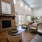 a spacious clubroom with a fireplace
