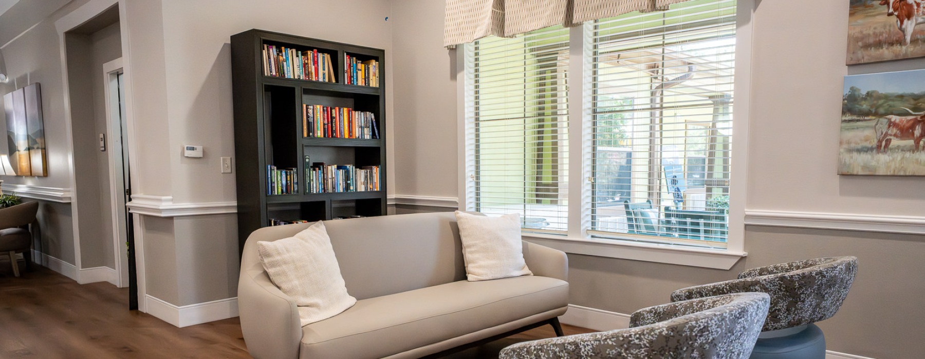 a lounge space with a window