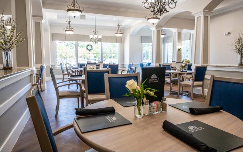 a dining room with tables set for a meal