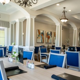 Enjoy our resident-only features a spacious dining room with blue chairs