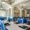 a spacious dining room with blue chairs