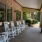 a row of rockers on a porch